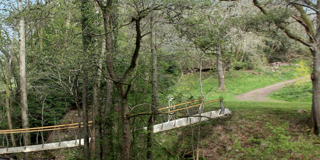 Elevation of stress ribbon footbridge over stream